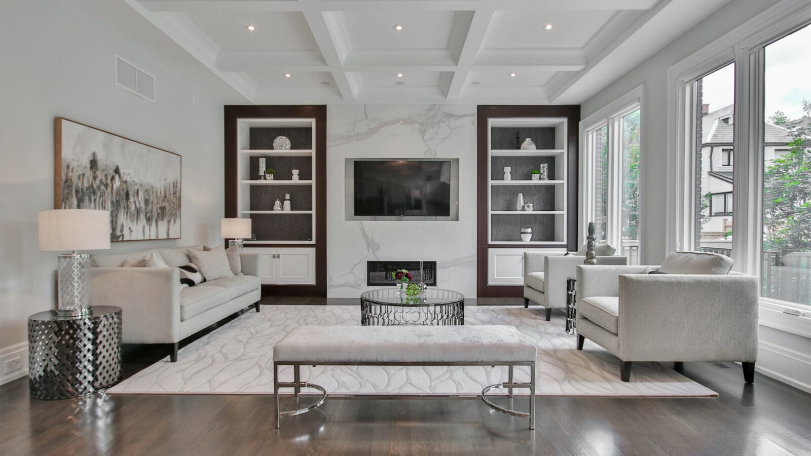 A living room with a false ceiling and cove lighting