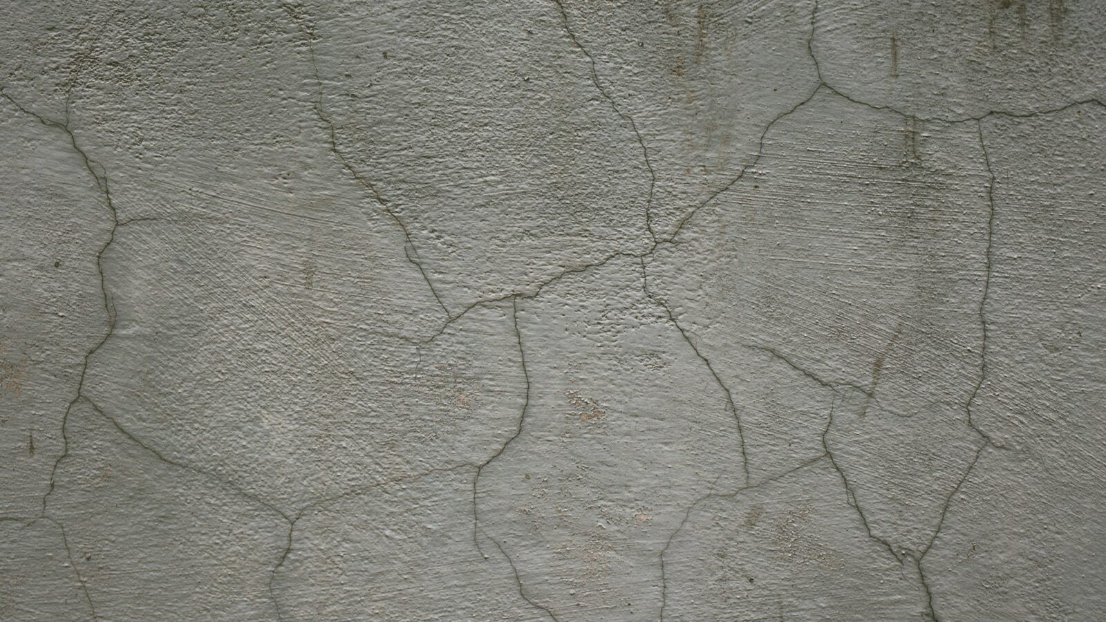 Deteriorated concrete with exposed and rusting reinforcement
